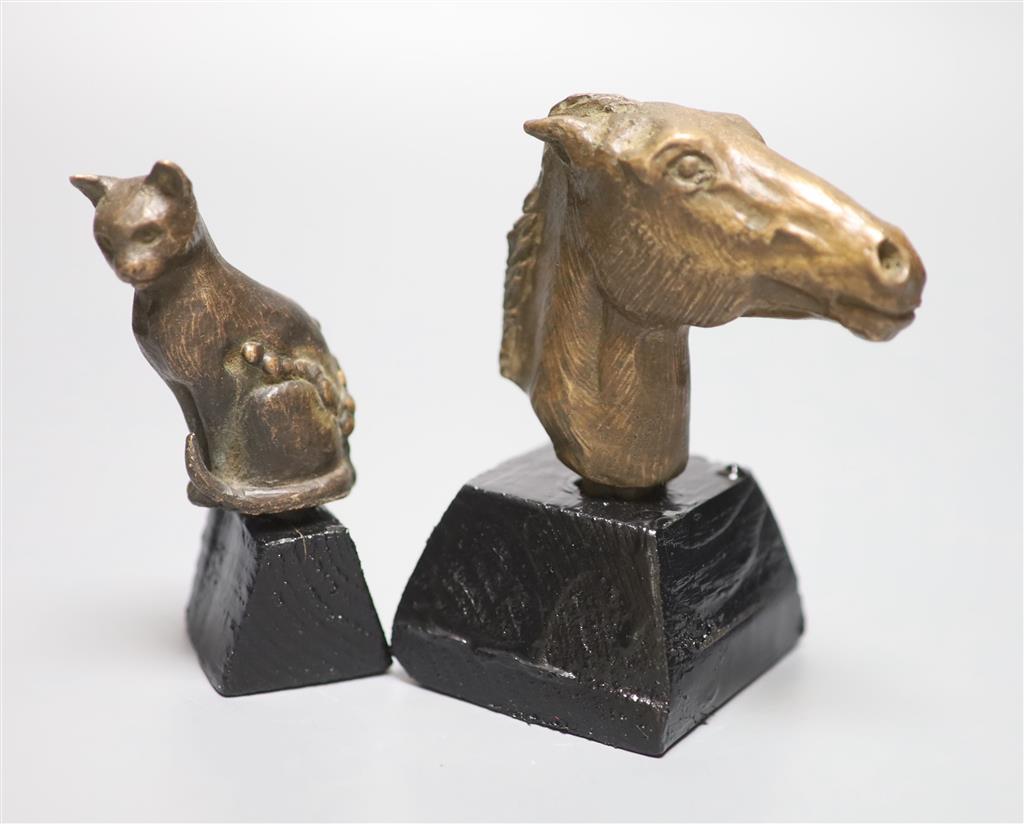 A bronze of a horses head, on stand, signed, height 12cm, and a similar cat